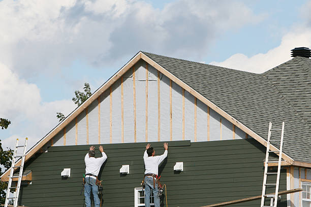 Professional Siding Replacement technician working in Scotland, MD
